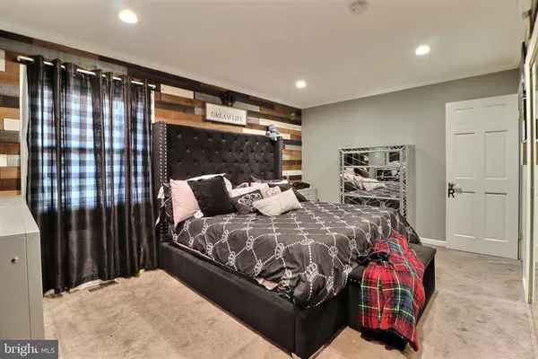 a bed room with a bed and a walk in closet