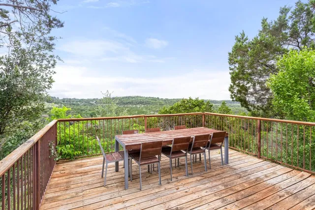 a view of deck with patio and yard
