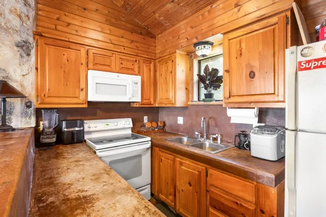a kitchen with a sink and cabinets