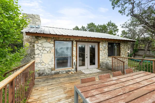a view of a house with wooden fence