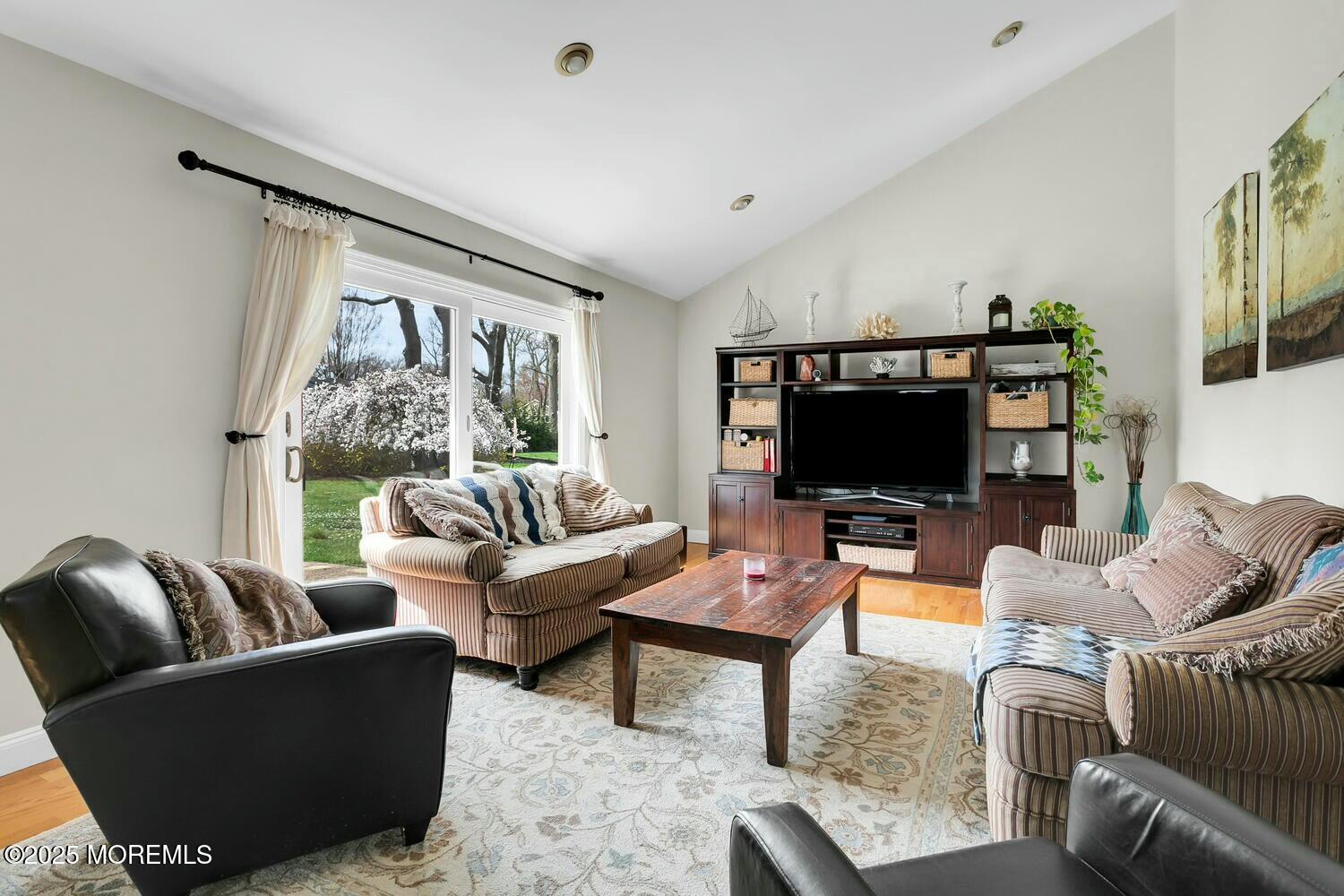 21 Judith Road Little Silver, NJ 07739 - Photo 19 of 48 a living room with furniture a flat screen tv and a large window