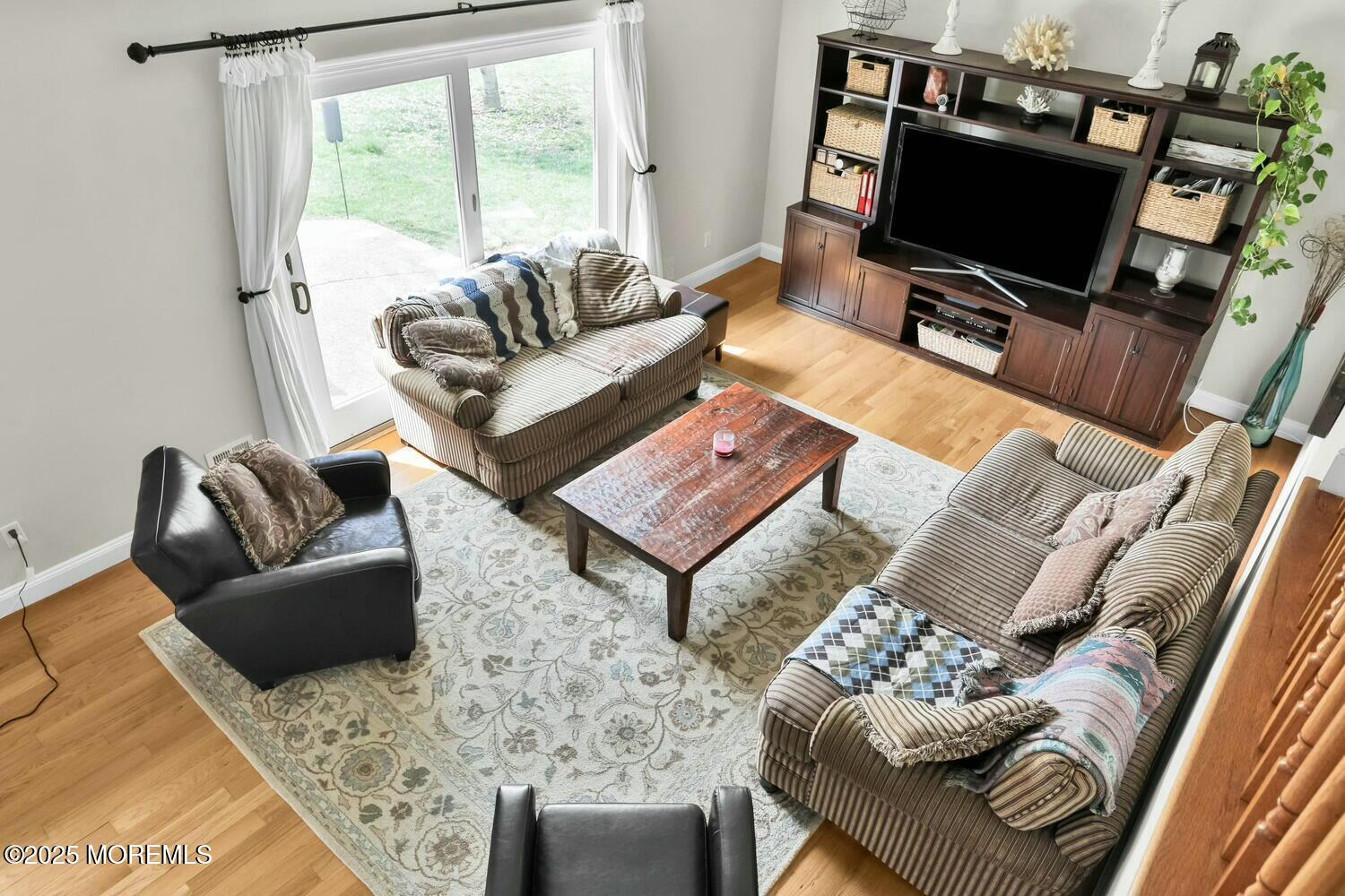 21 Judith Road Little Silver, NJ 07739 - Photo 20 of 48 a living room with furniture a flat screen tv and a large window