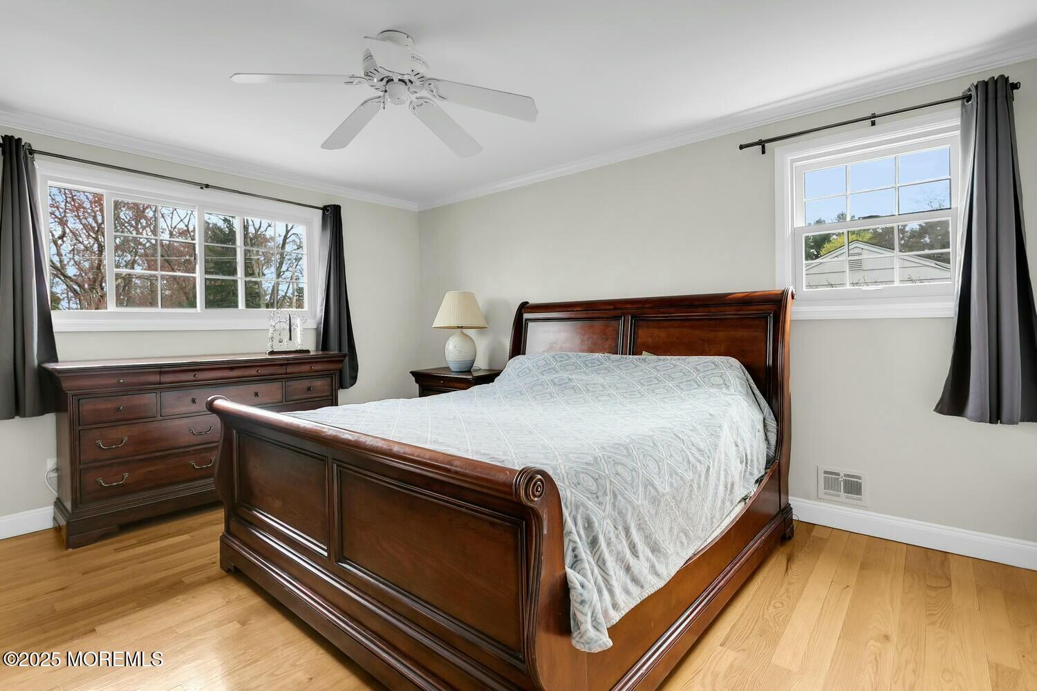 21 Judith Road Little Silver, NJ 07739 - Photo 24 of 48 a bedroom with a bed and a dresser with wooden floor