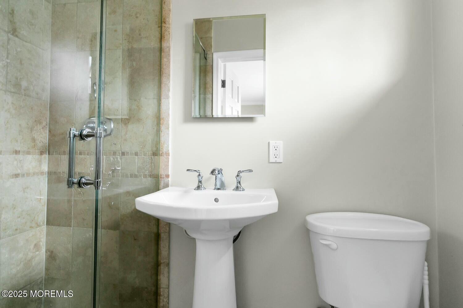 21 Judith Road Little Silver, NJ 07739 - Photo 25 of 48 a bathroom with a sink toilet and mirror