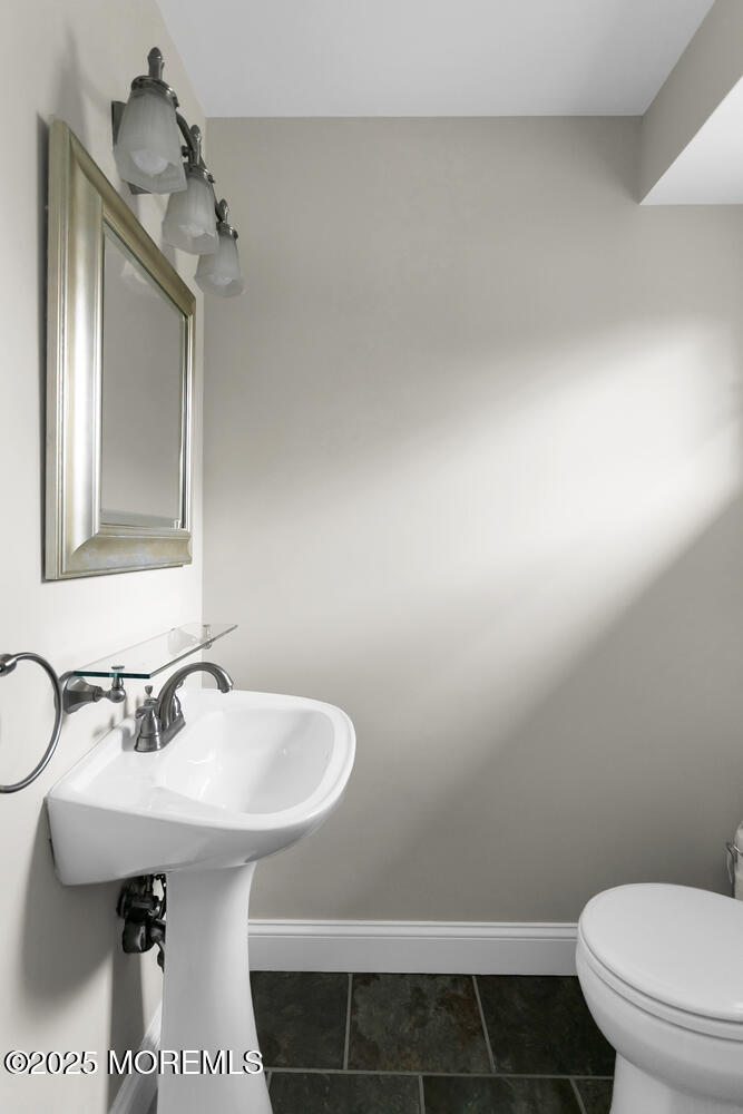 21 Judith Road Little Silver, NJ 07739 - Photo 26 of 48 a bathroom with a sink toilet and mirror
