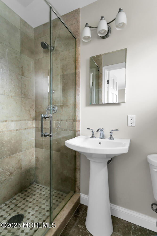 21 Judith Road Little Silver, NJ 07739 - Photo 27 of 48 a bathroom with a sink a toilet and shower