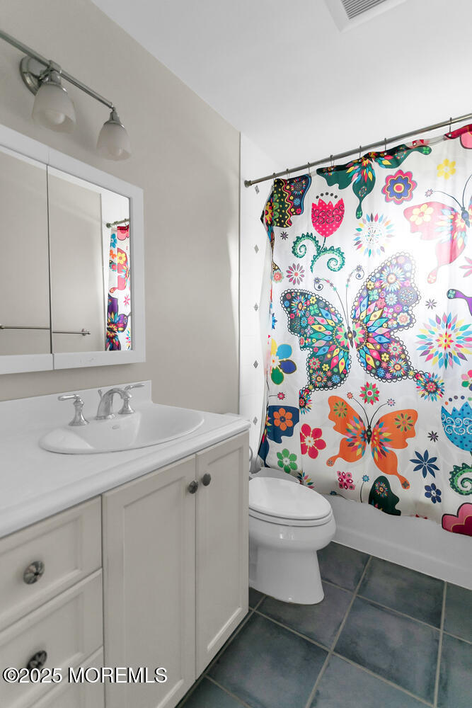 21 Judith Road Little Silver, NJ 07739 - Photo 30 of 48 a bathroom with a sink mirror vanity and toilet