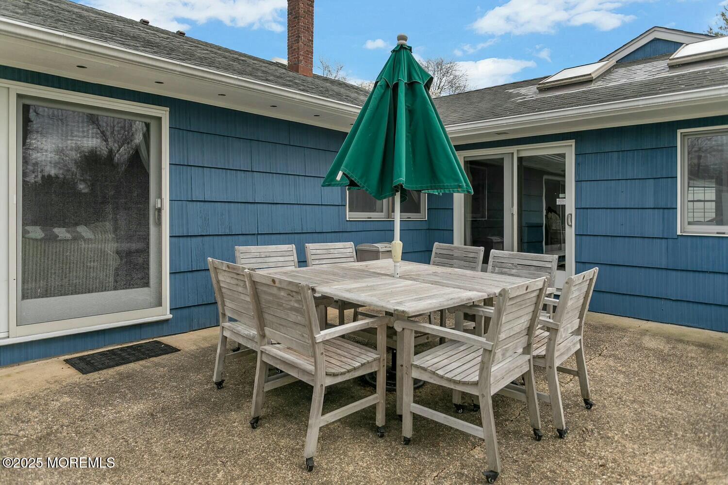 21 Judith Road Little Silver, NJ 07739 - Photo 37 of 48 a patio with a table and chairs