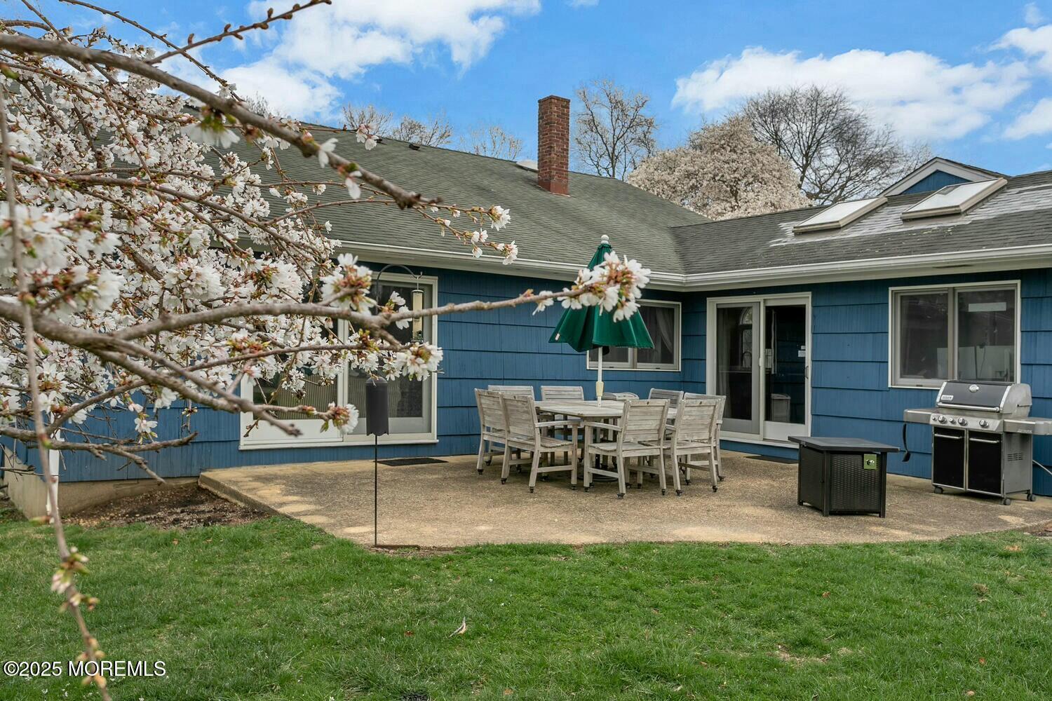 21 Judith Road Little Silver, NJ 07739 - Photo 38 of 48 a view of a house with patio and a yard