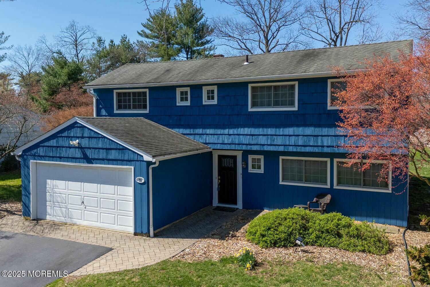 21 Judith Road Little Silver, NJ 07739 - Photo 48 of 48 a front view of a house with a yard and garage