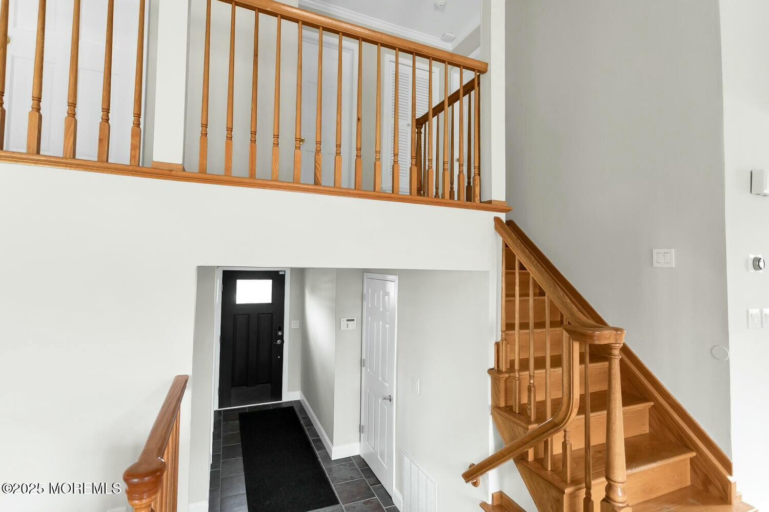 21 Judith Road Little Silver, NJ 07739 - Photo 8 of 48 a view of staircase with lots of frames on wall and a window