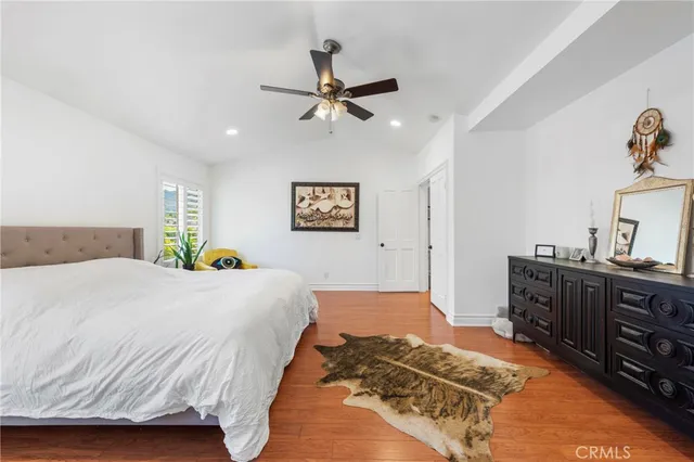 a bedroom with a bed and dresser