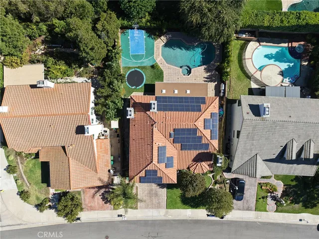 an aerial view of residential house with outdoor space and parking