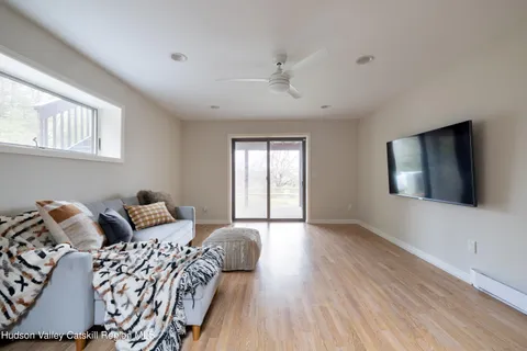 a bathroom with a granite countertop sink toilet and mirror