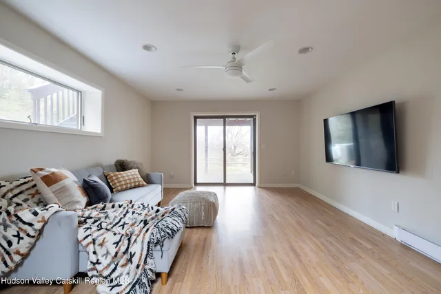 a bathroom with a granite countertop sink toilet and mirror