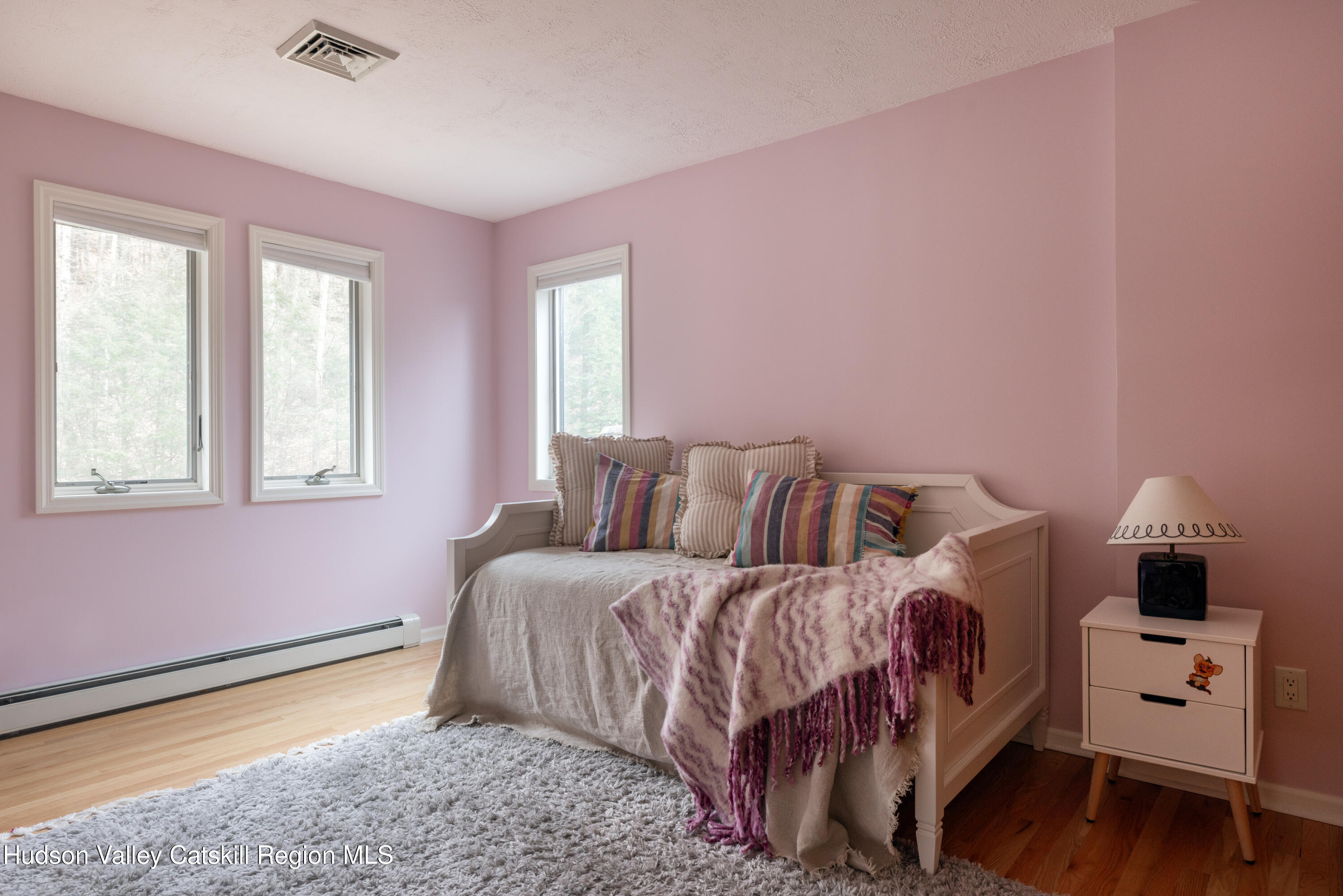 51 Barnum Road Windham, NY 12454 - Photo 28 of 41 a bedroom with a bed and wooden floor