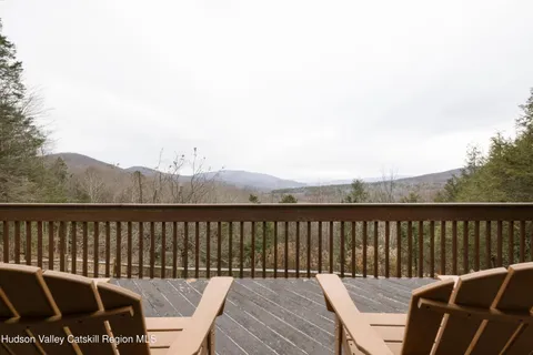 a view of a balcony with furniture
