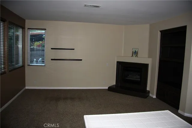 a living room with a fireplace