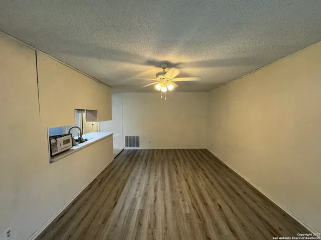 a view of a livingroom with wooden floor