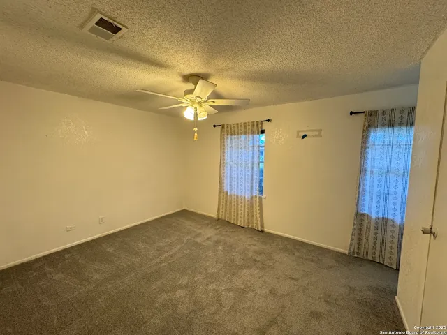 an empty room with a bathroom