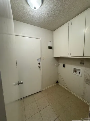 a view of a storage and utility room with closet