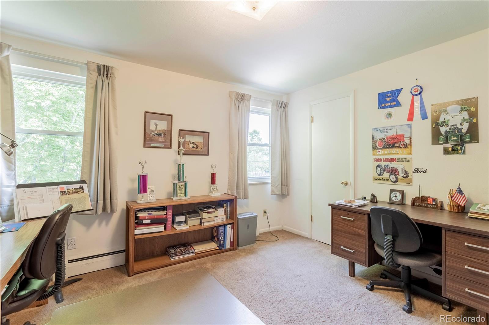 6001 Welch Street Arvada, CO 80004 - Photo 18 of 32 a view of a workspace with furniture and a window