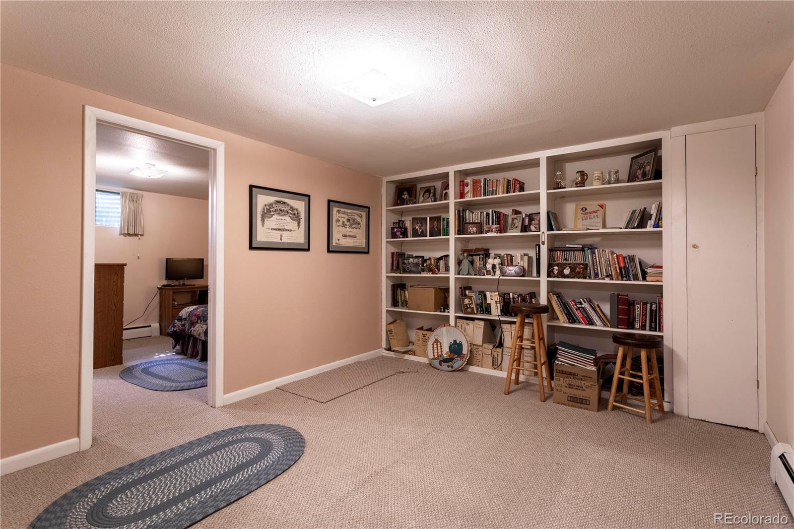 6001 Welch Street Arvada, CO 80004 - Photo 21 of 32 a livingroom with a workspace