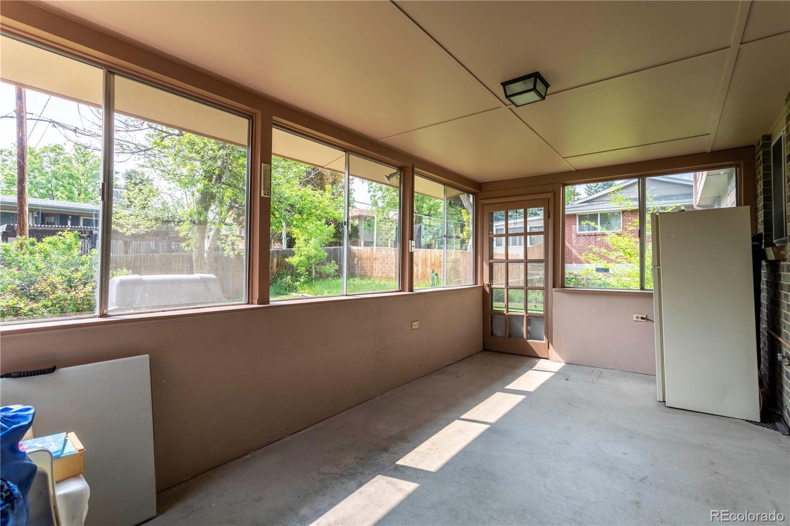 6001 Welch Street Arvada, CO 80004 - Photo 23 of 32 a view of an empty room with a window