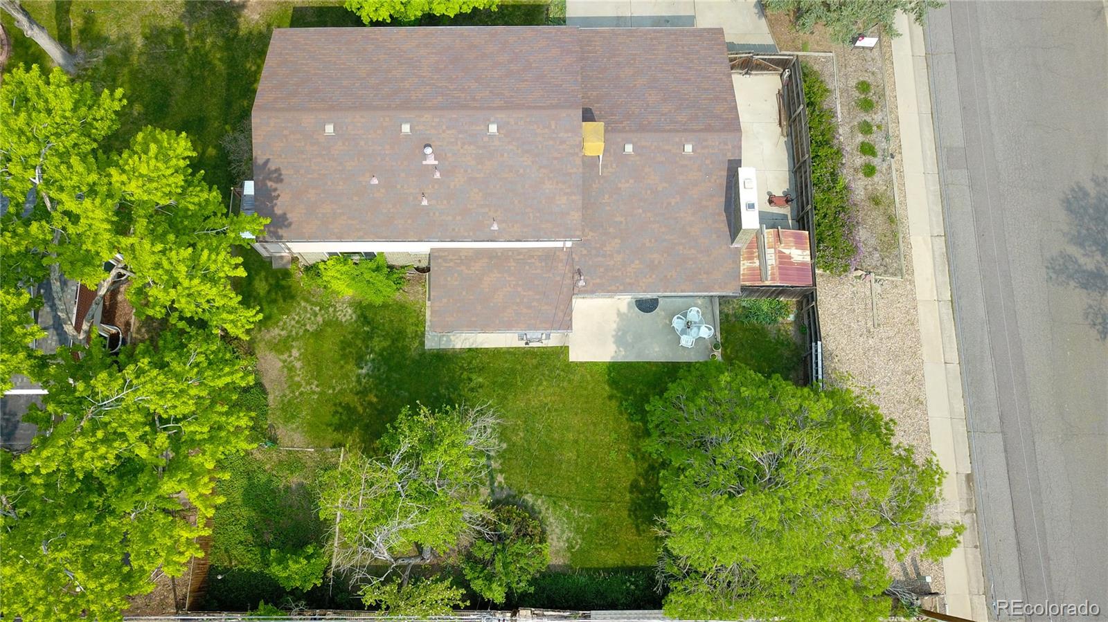 6001 Welch Street Arvada, CO 80004 - Photo 27 of 32 an aerial view of a house with a yard and garden