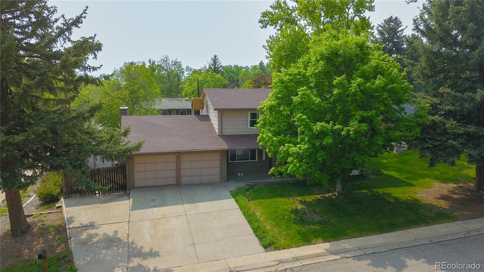 6001 Welch Street Arvada, CO 80004 - Photo 28 of 32 an aerial view of a house with a yard
