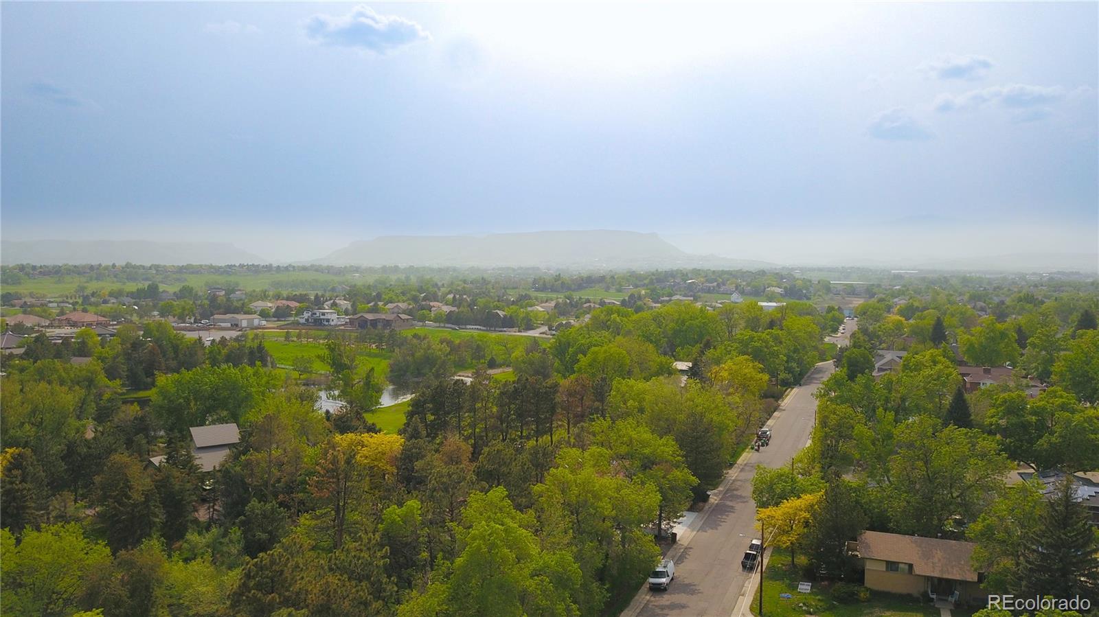 6001 Welch Street Arvada, CO 80004 - Photo 29 of 32 an aerial view of residential houses with outdoor space and trees