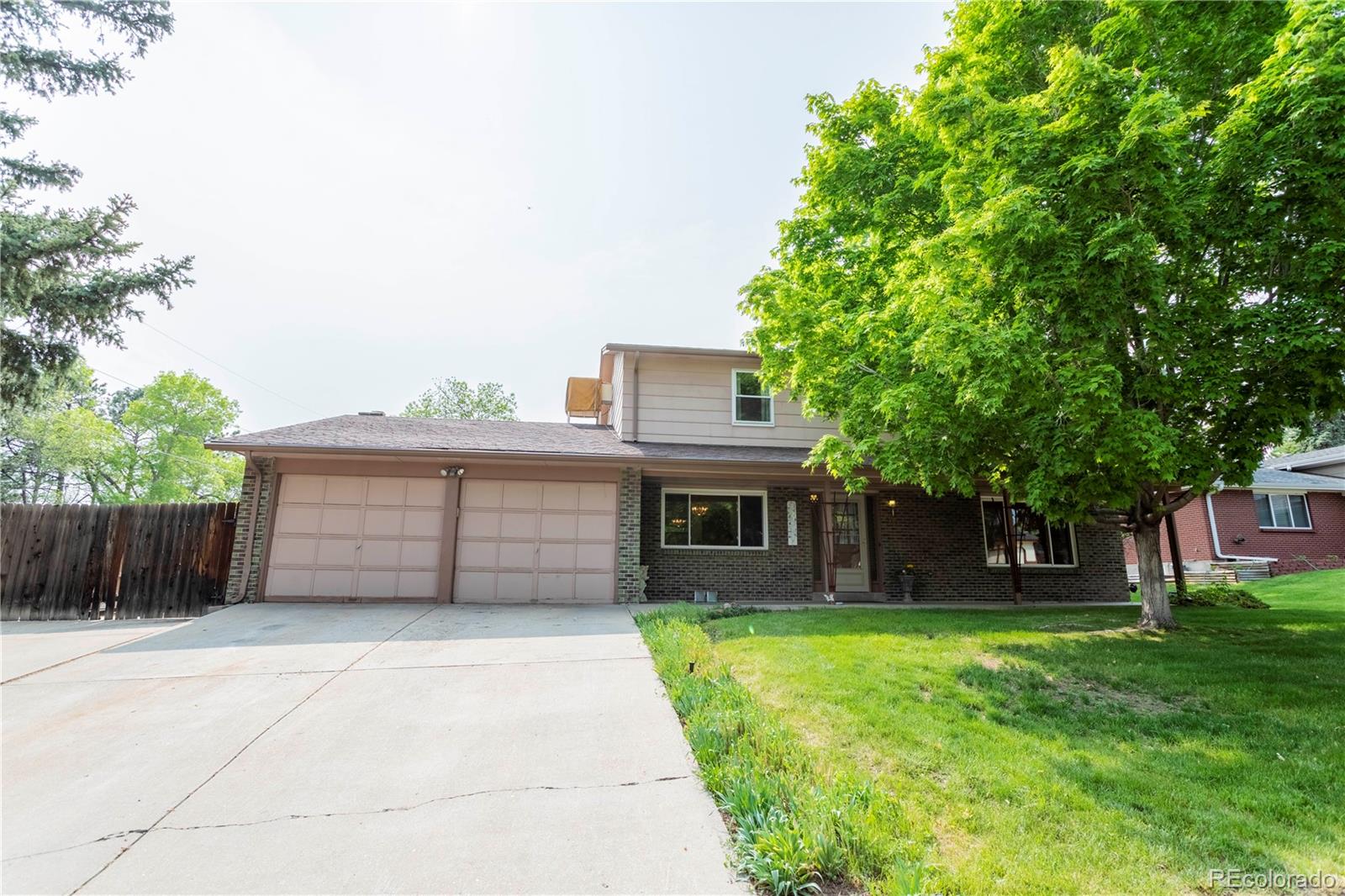 6001 Welch Street Arvada, CO 80004 - Photo 3 of 32 a house view with a outdoor space