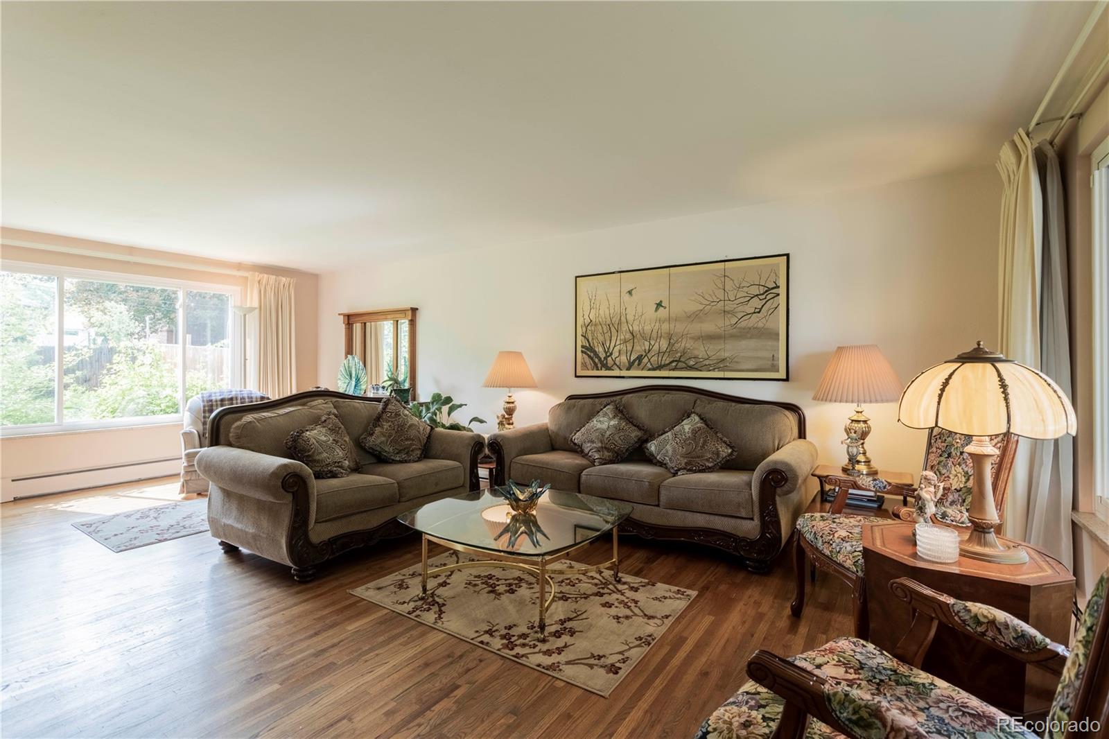 6001 Welch Street Arvada, CO 80004 - Photo 7 of 32 a living room with furniture and a large window