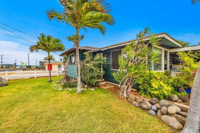 a view of a chairs and table in the patio