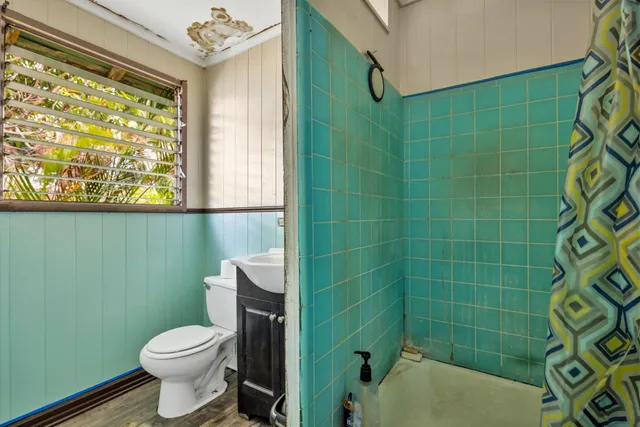 a bathroom with a toilet a sink and bathtub