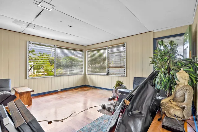 a view of a kitchen with a sink and dishwasher with a dining table