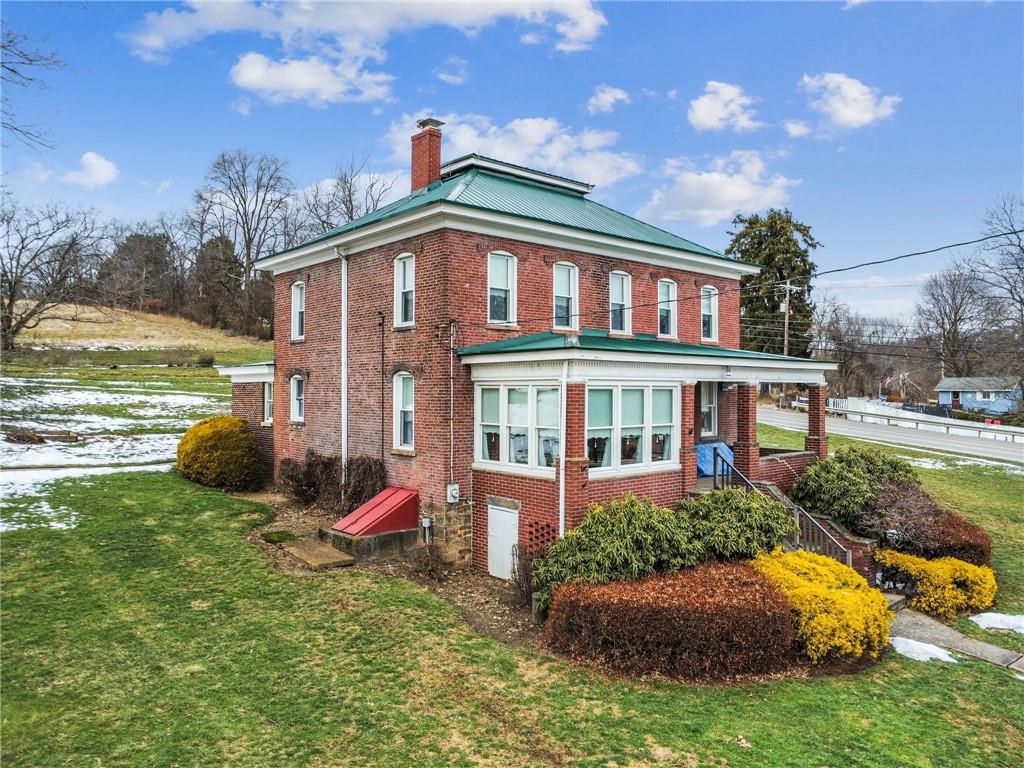 737 Buttermore Road Ruffs Dale, PA 15679 - Photo 2 of 39 a front view of a house with garden