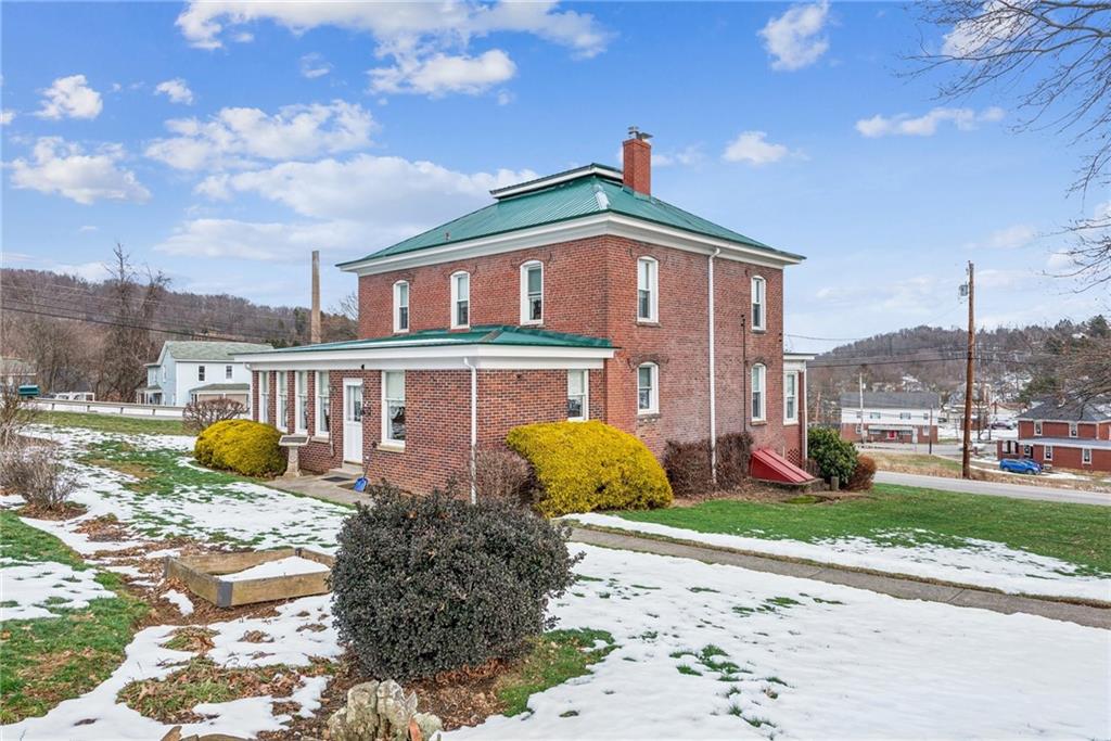 737 Buttermore Road Ruffs Dale, PA 15679 - Photo 33 of 39 a front view of a house with garden