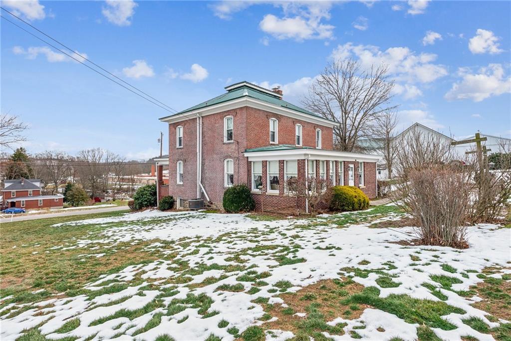 737 Buttermore Road Ruffs Dale, PA 15679 - Photo 34 of 39 a view of a house with a yard