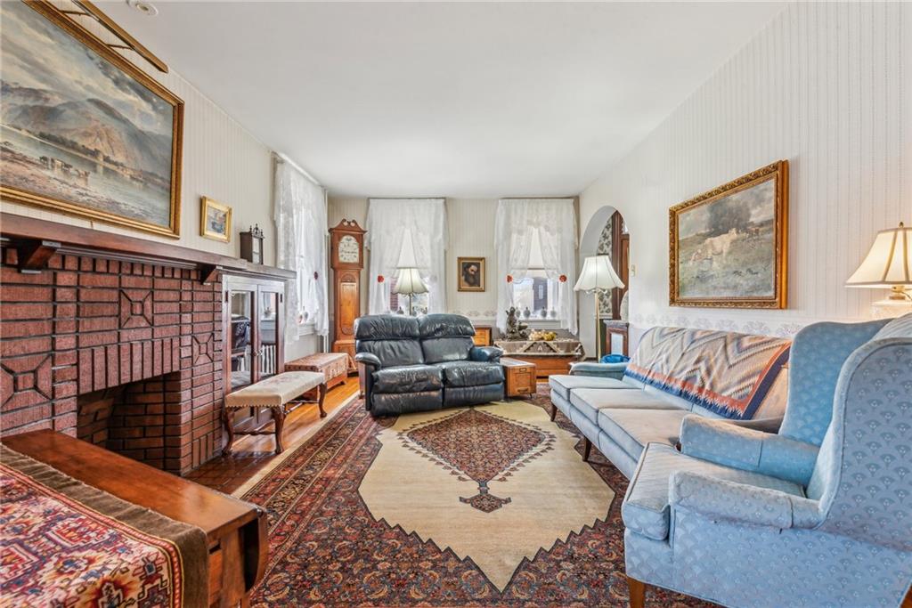 737 Buttermore Road Ruffs Dale, PA 15679 - Photo 6 of 39 a living room with furniture fireplace and a window