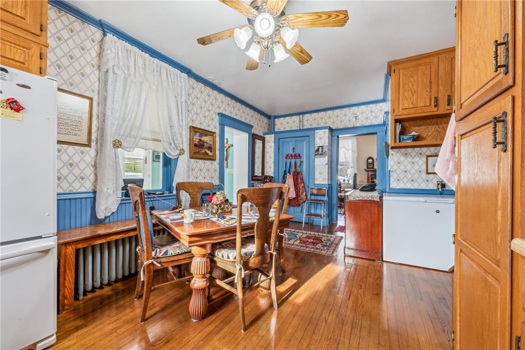 737 Buttermore Road Ruffs Dale, PA 15679 - Photo 8 of 39 a dining room with furniture a chandelier and wooden floor