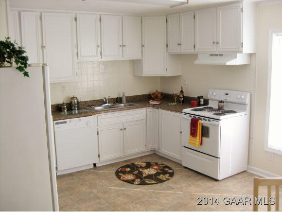 834 Augusta Farms Road Waynesboro, VA 22980 - Photo 4 of 17 a kitchen with a sink a stove and cabinets