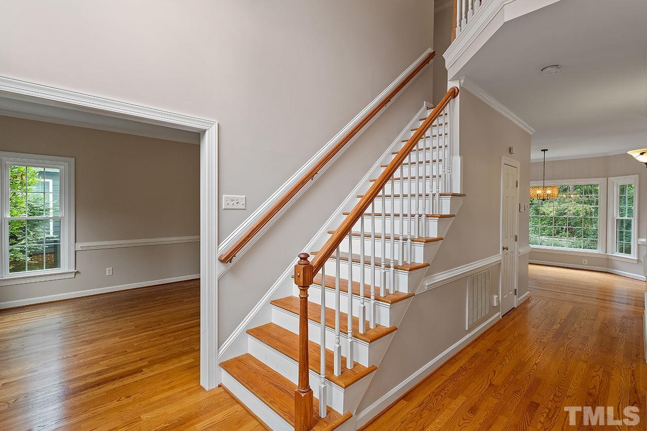 403 Danton Drive Cary, NC 27518 - Photo 13 of 38 a view of entryway with wooden floor and front door