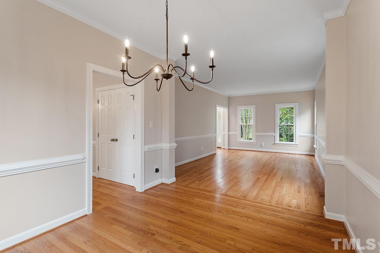 403 Danton Drive Cary, NC 27518 - Photo 17 of 38 a view of an empty room with wooden floor and a window