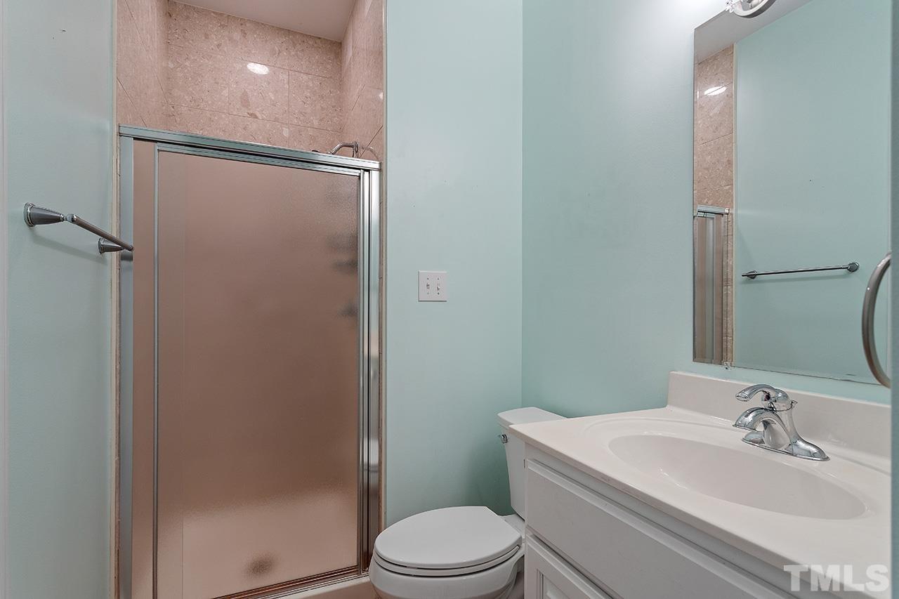 403 Danton Drive Cary, NC 27518 - Photo 22 of 38 a bathroom with a sink toilet and shower