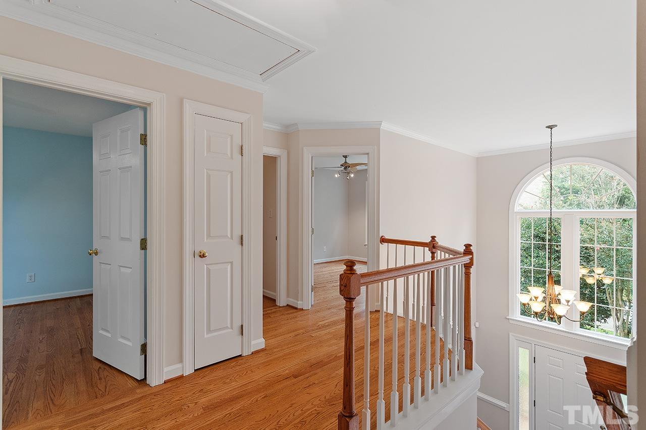 403 Danton Drive Cary, NC 27518 - Photo 23 of 38 a view of a hallway with wooden floor and entryway