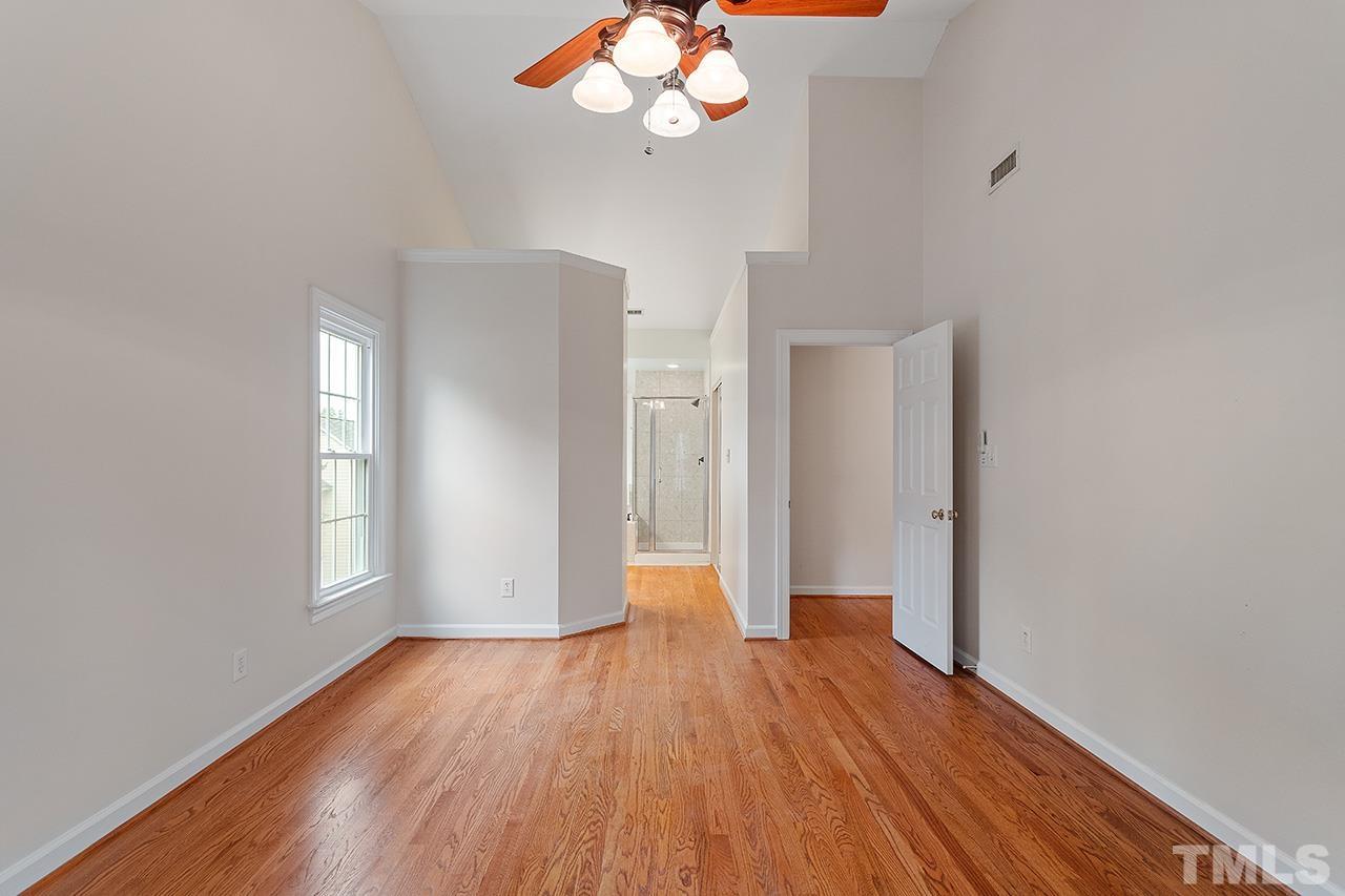 403 Danton Drive Cary, NC 27518 - Photo 24 of 38 a view of an empty room with wooden floor and a window