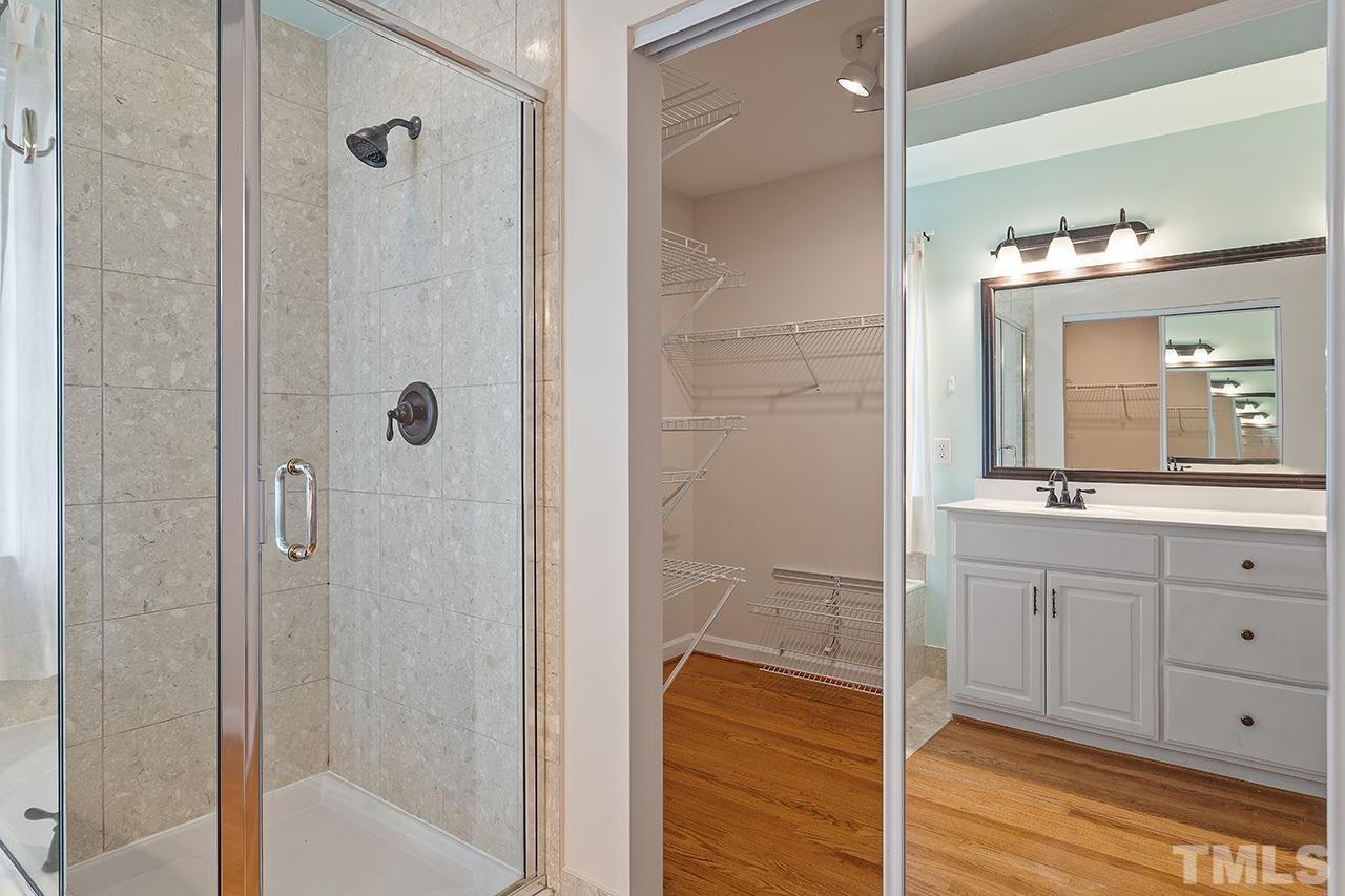 403 Danton Drive Cary, NC 27518 - Photo 26 of 38 a bathroom with a shower and a sink