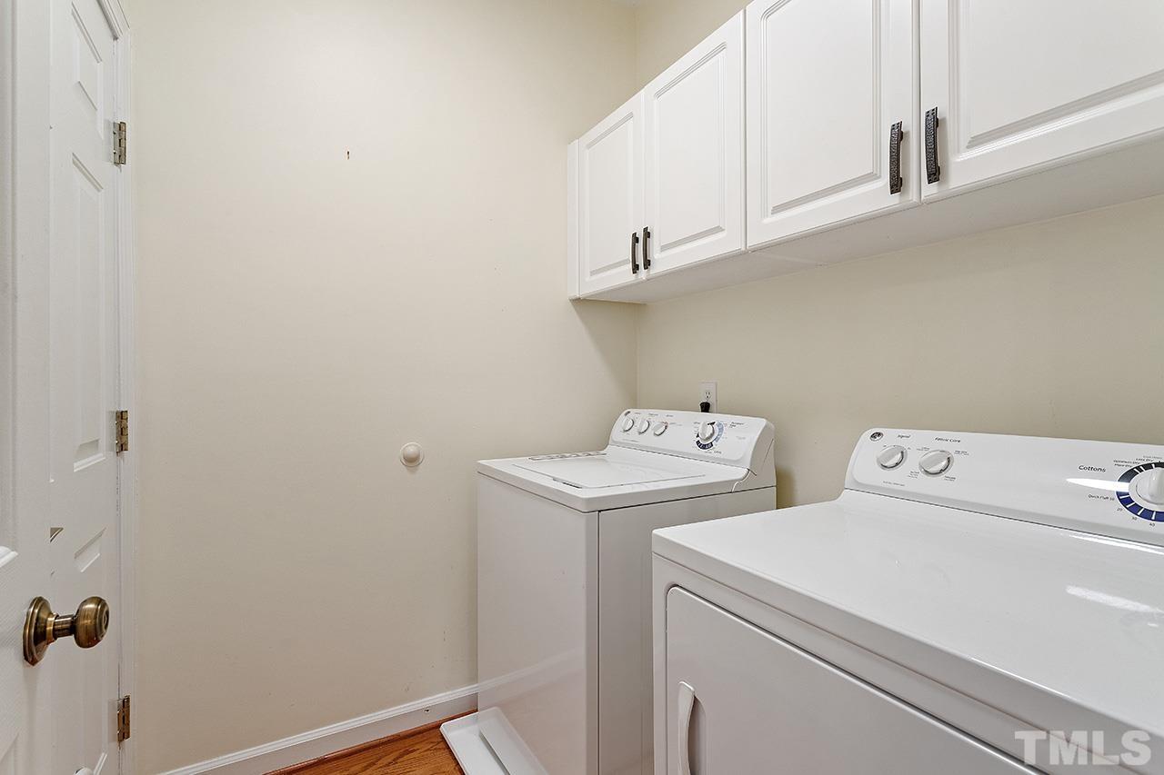 403 Danton Drive Cary, NC 27518 - Photo 32 of 38 a utility room with dryer and washer