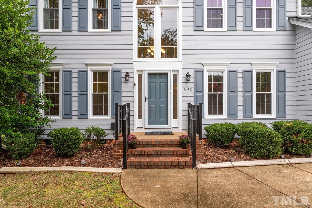 403 Danton Drive Cary, NC 27518 - Photo 35 of 38 a view of brick house with potted plants